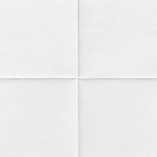 White paper texture with crossing folds White paper texture with a horizontal crease crossing a vertical fold at the center.